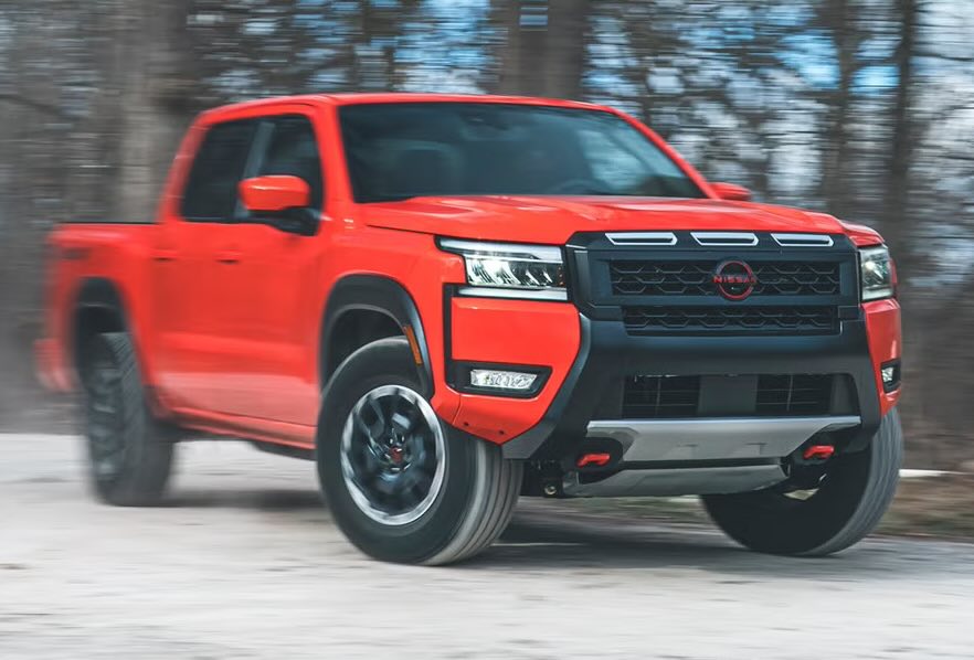A photo of a red Nissan Frontier, one of several trims available.